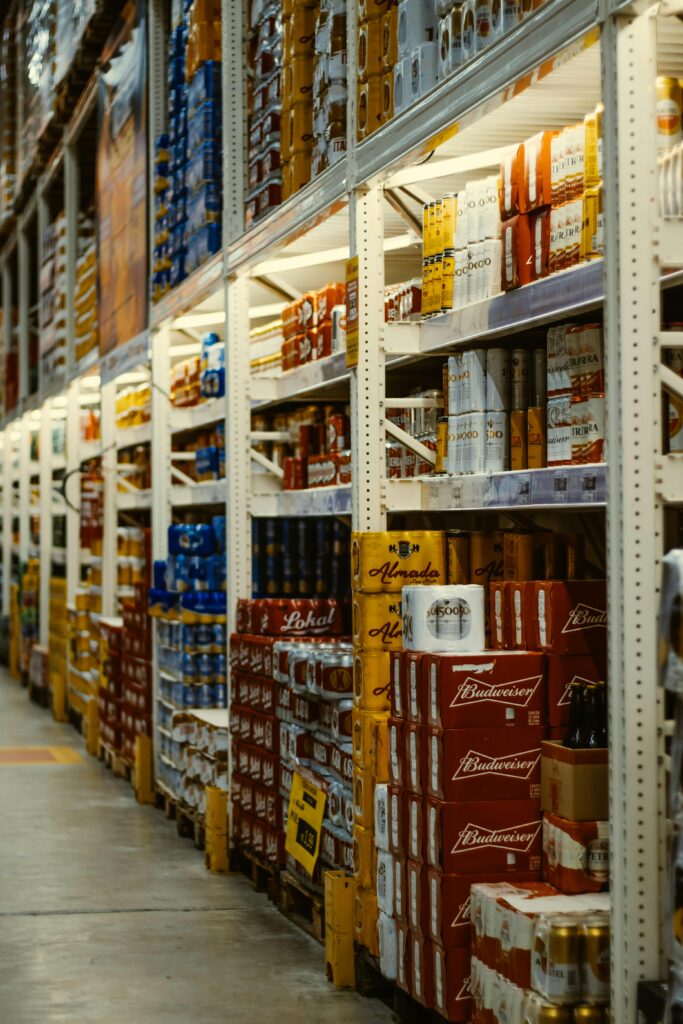 pexels photo 5498026 5498026 Rows of beer and beverages stacked neatly in a supermarket aisle.